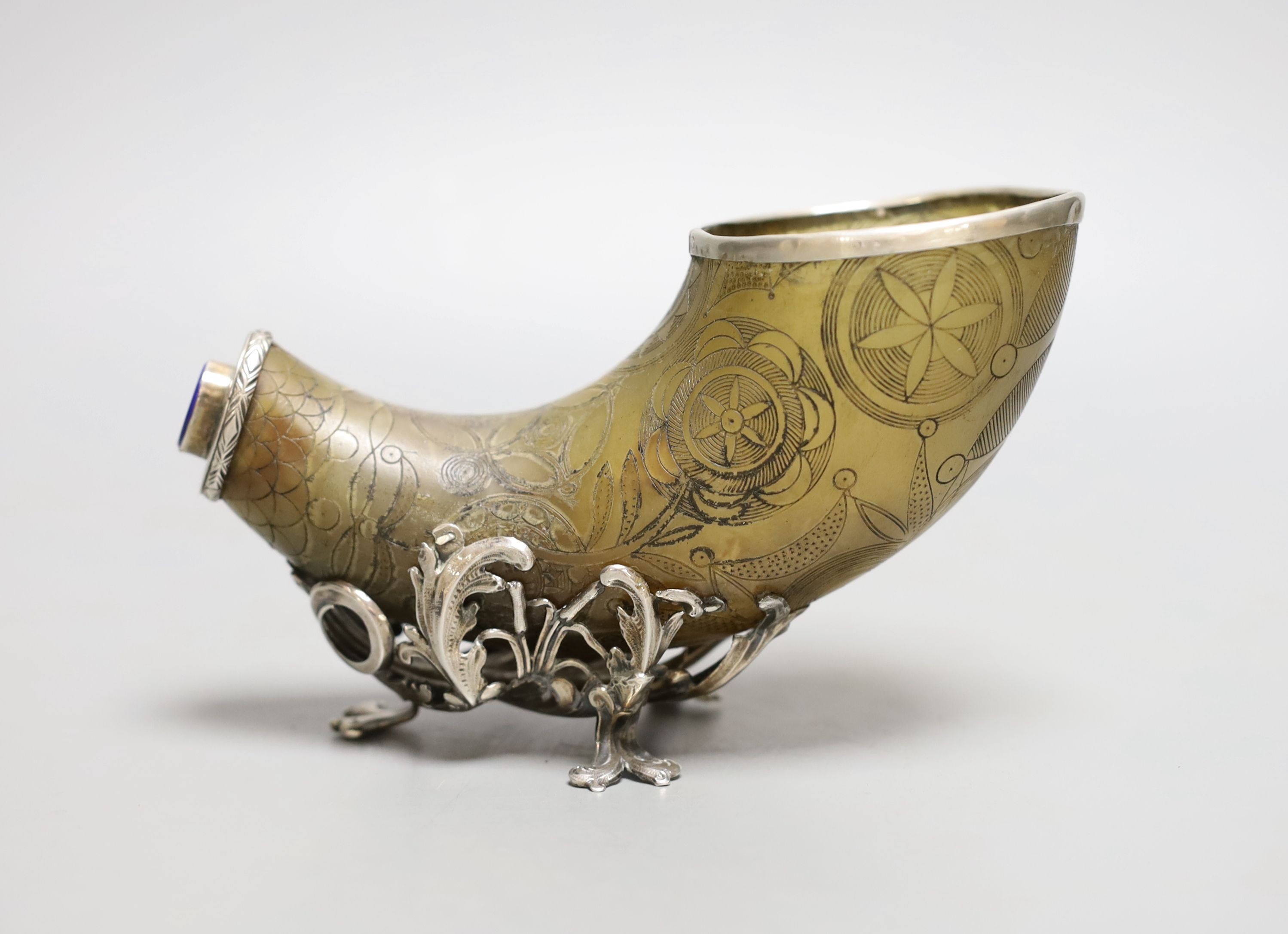 An 18th century, silver mounted decorated horn, with lapis mount, 25 cms wide.